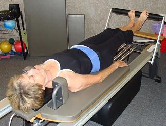 Feet In Straps on the Reformer  Pseudo-Closed Chain Exercise 