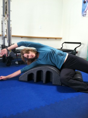 Pilates side stretch on arc image