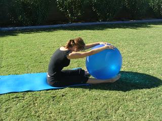 pilates spine stretch forward over exercise ball image