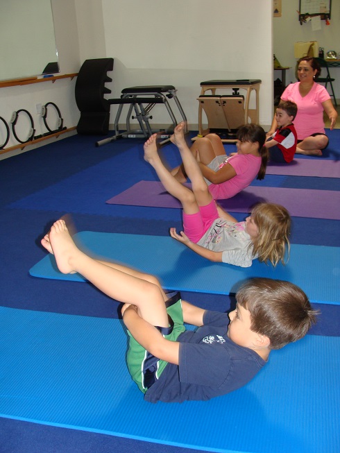 kids rolling Pilates