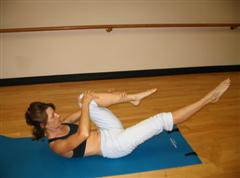 Pilates single leg stretch imag